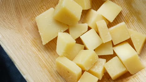 Close-up-of-cube-shape-fresh-cheese-on-in-a-bowl