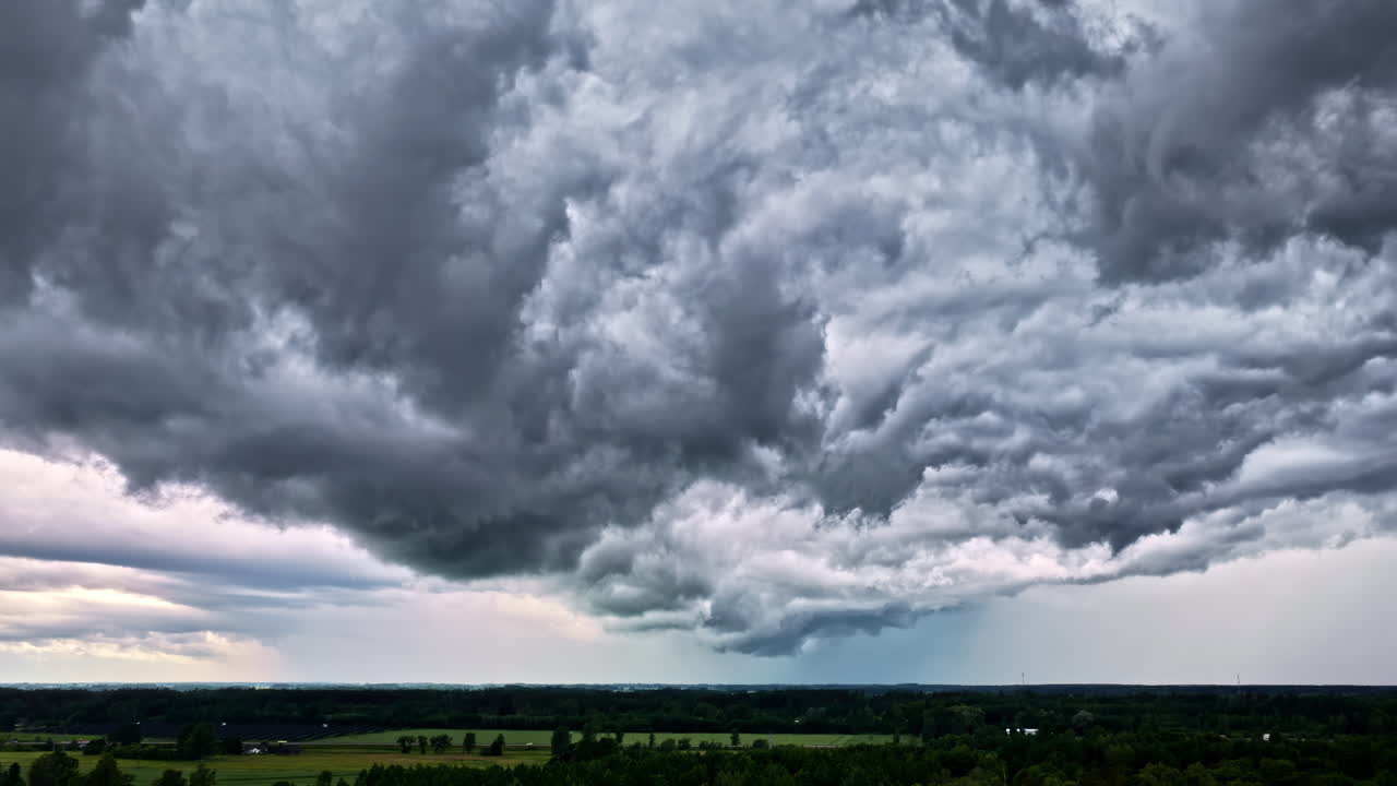 Dramatic time lapse capturing heavy clouds swiftly moving across a dynamic sky scene