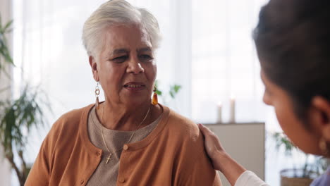 elderly woman receiving support and comfort from a caregiver