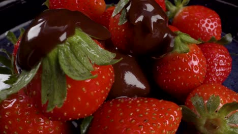 pouring chocolate over fresh strawberries, rotating closeup shot in 4k