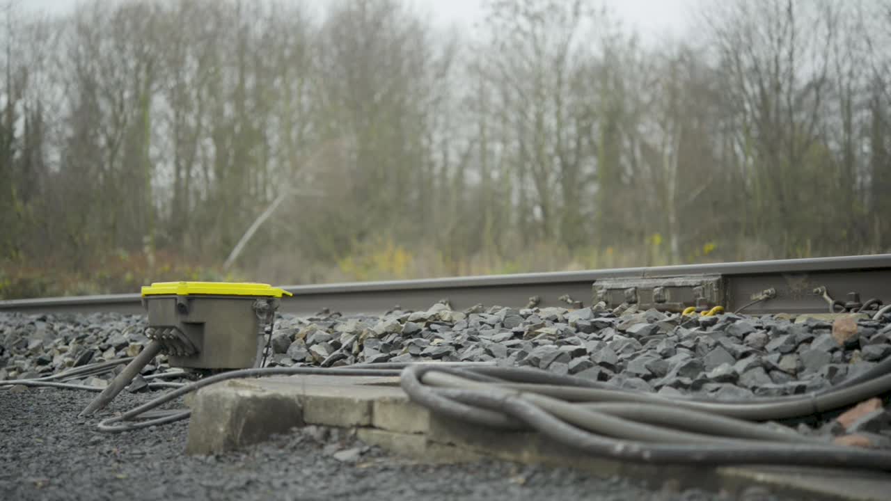 Train Passing by on Railway Tracks with Monitoring Equipment