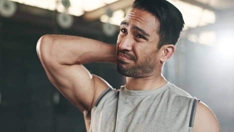 Fitness,-neck-pain-and-face-of-man-at-gym