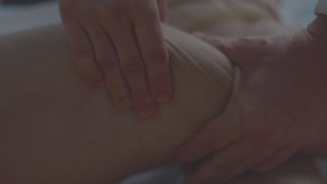 physiotherapist massaging with her hands