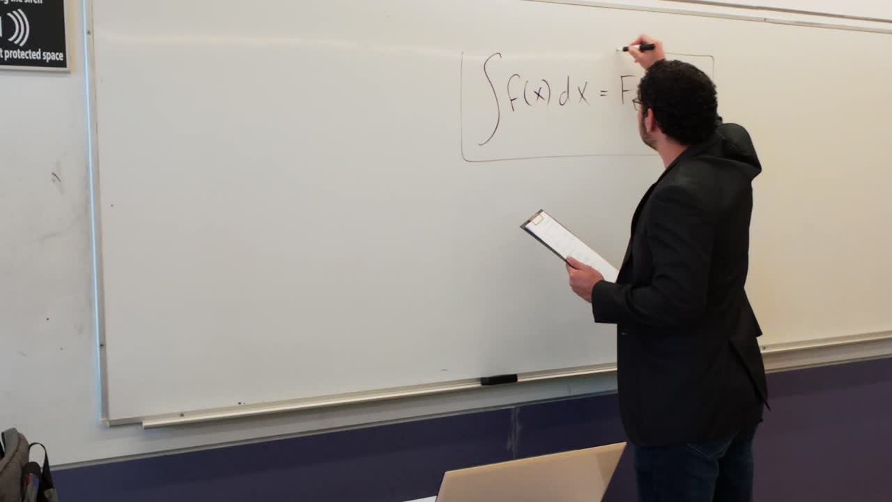 Math Professor Explains Integral Calculus on Whiteboard