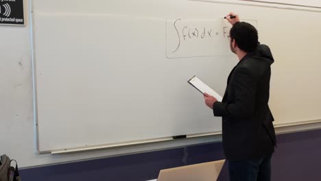 math professor explains integral calculus on whiteboard