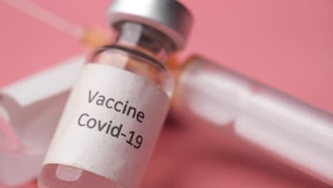 covid-19 vaccine vials and syringe