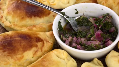 homemade empanadas on a rotating plate (seamless loopable)