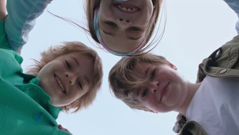 group of friends standing in circle.