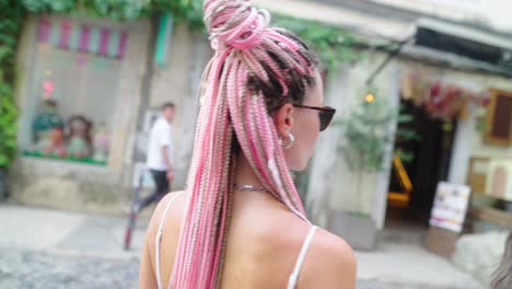 woman walking down a european alleyway