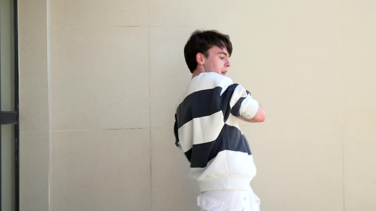 Man dancing in white outfit