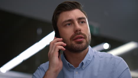 professional ceo calling mobile phone smiling talking manager in workplace.