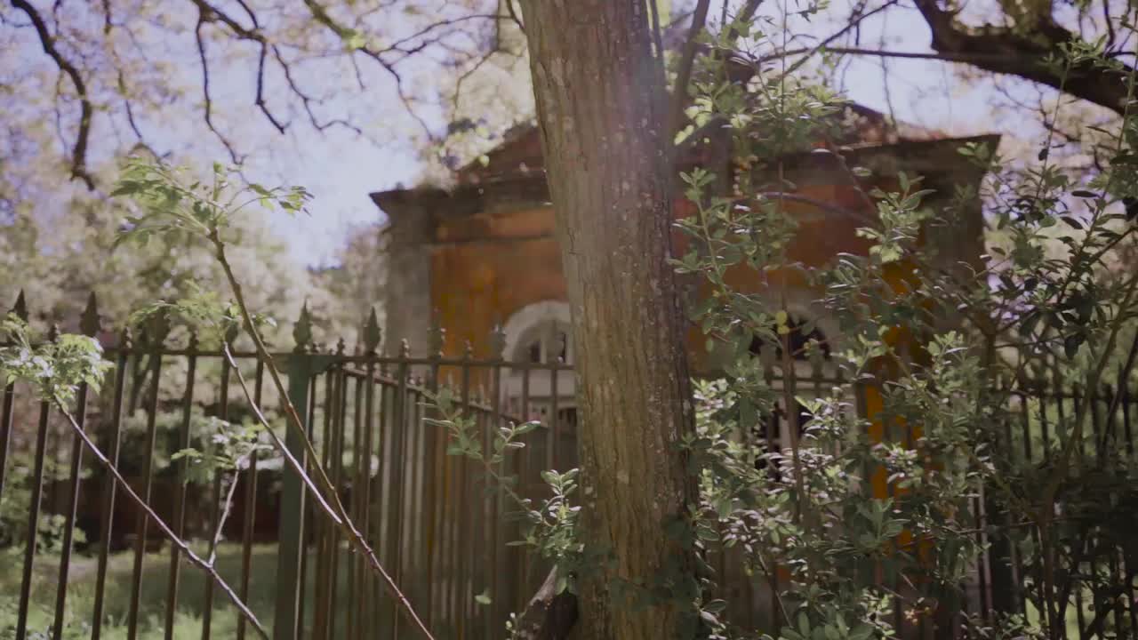 Abandoned Houses through rusty fences