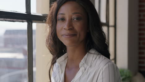 beautiful-african-american-woman-drinking-coffee-at-home-smiling-happy-enjoying-successful-lifestyle-looking-out-window-planning-ahead-mature-black-female-relaxing-in-cozy-apartment-loft