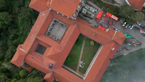 Drone-Spinning-Over-Santo-Estevo-Monastery-At-Event,-Luintra,-Spain