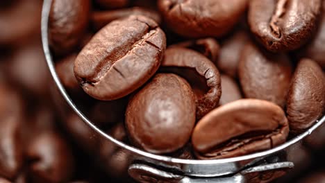 close up of seeds of coffee. fragrant coffee beans are roasted smoke comes from coffee beans.