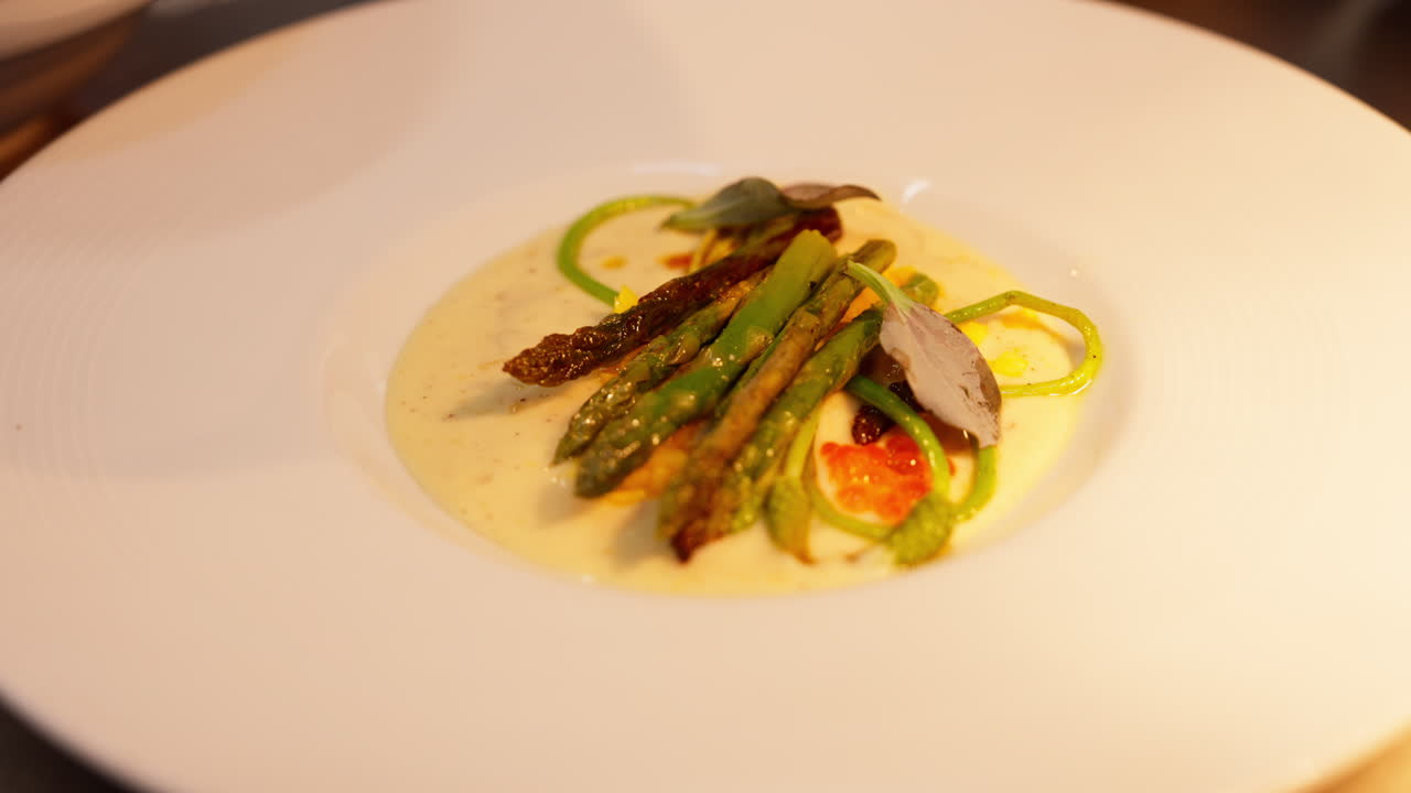 Fine dining: courses being carefully prepared in the kitchen by the chef