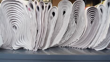 a stack of rolled up newspapers