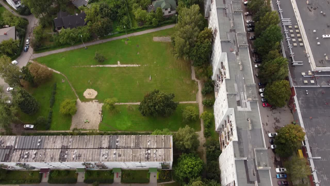 Old apartment buildings and parking lot of Riga suburbs, aerial view