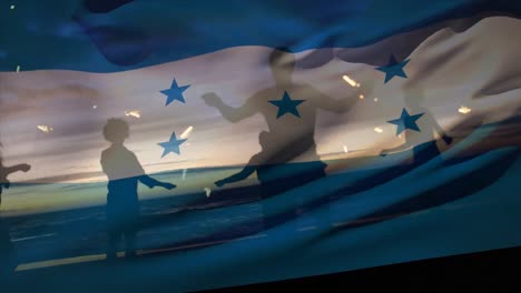 animation of waving of honduras flag over group of friends on the beach