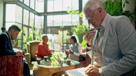 people working in an office lobby
