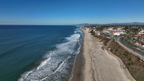 Aerial-drone-shot-over-the-sandy-beaches-of-Carlsbad