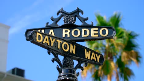 via rodeo and dayton way sign