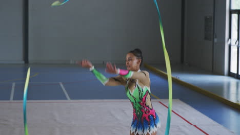 female gymnast performing at sports hall