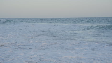 Panning-shot-from-the-Pacific-Ocean-to-shore-located-in-Southern-California