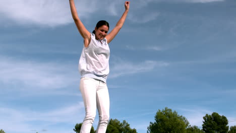 adult jumping on a trampoline