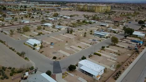 Aerial-flyover-of-partially-abandoned-Mobile-Home-Park-in-desert-town