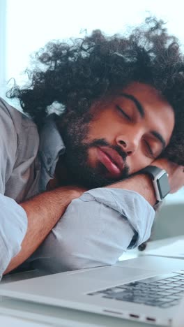 a peaceful moment of rest for a tired young man in a cozy setting