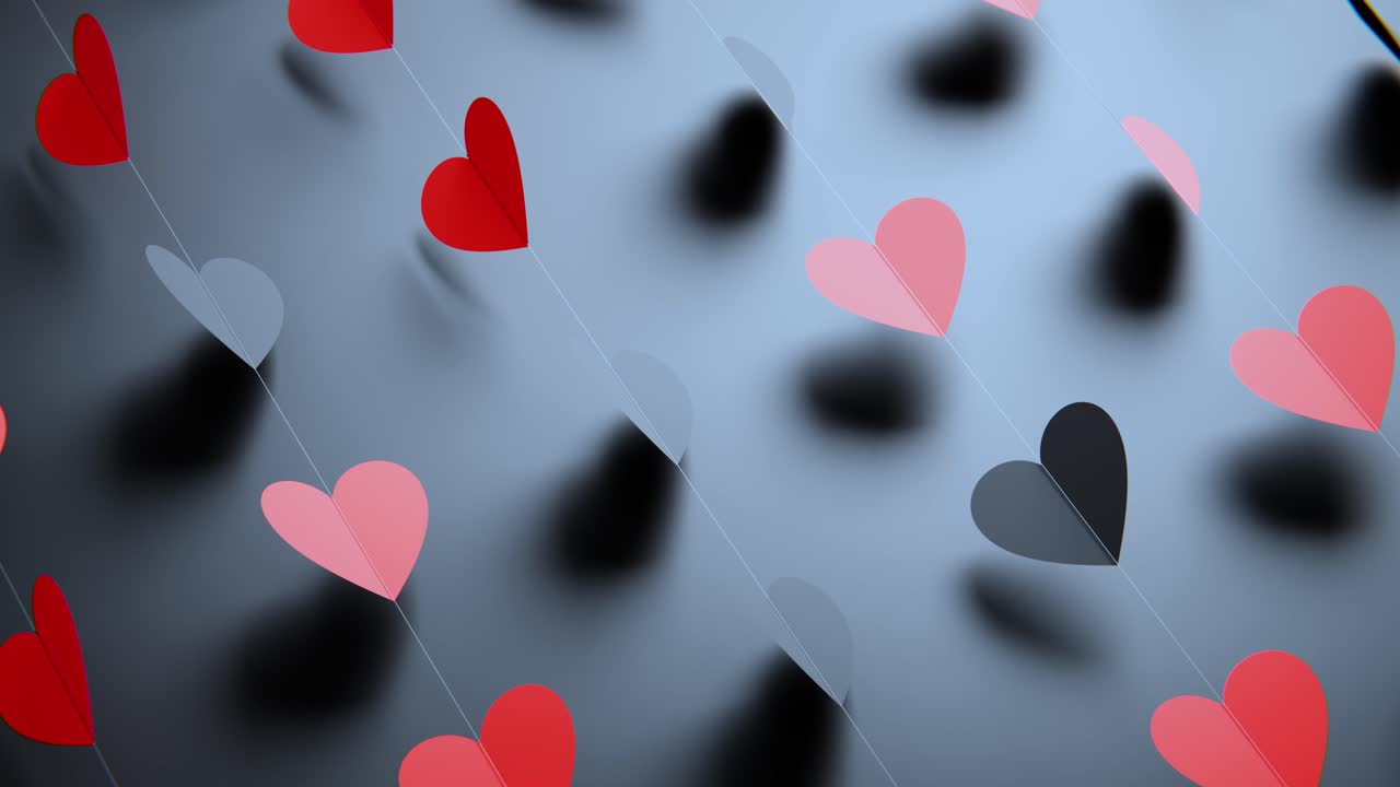 Motivo astratto di cuori di carta rossi e rosa rotanti.