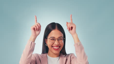 smile, face and woman pointing up in studio