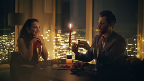 amorous lovers engaging evening romantic dinner closeup. man making proposal