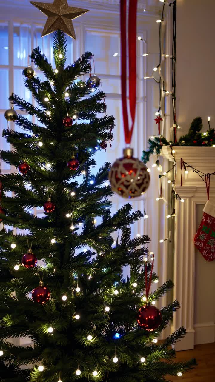 Festive Christmas tree with red and white ornaments, captured from a low angle