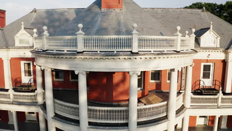 descending aerial view shows the entire frontage of roger williams park casino building