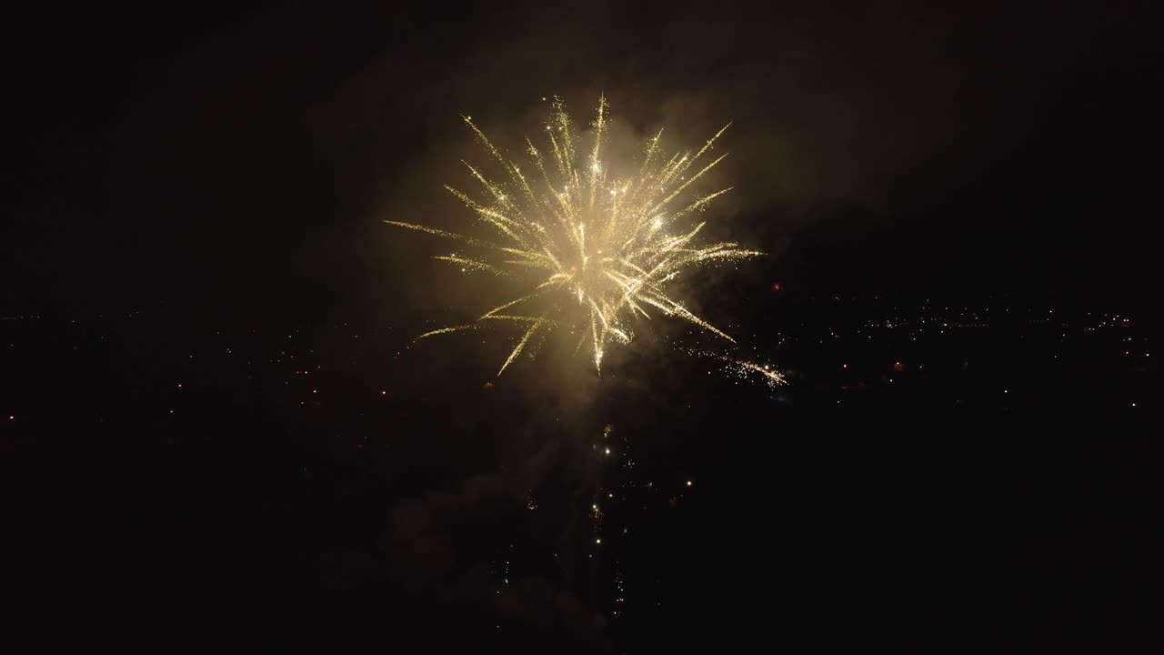 Drone footage of celebrating with fireworks.