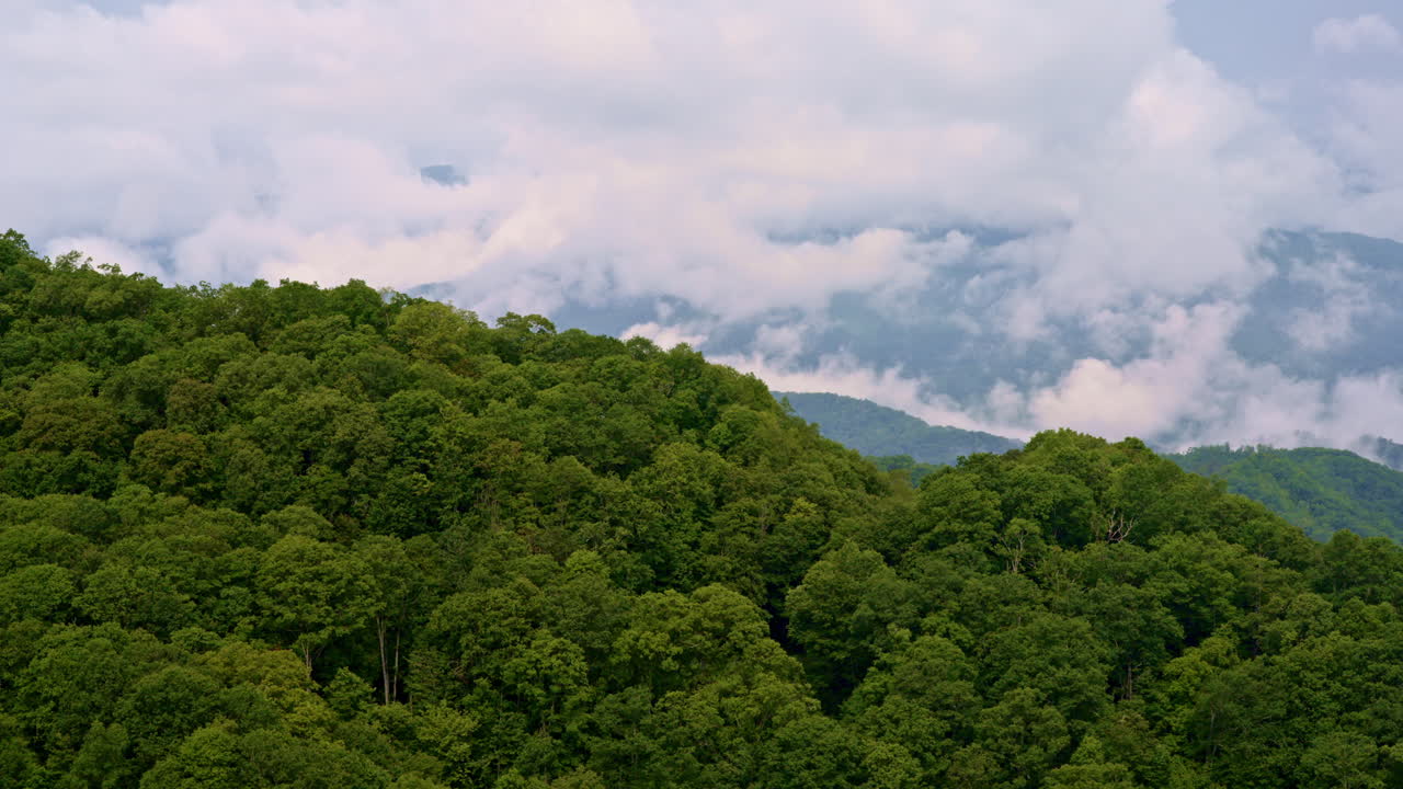 Aerial drone flight through fog banks colliding with cloud layers
