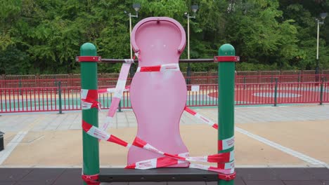 a closed game with tapes at a public playground due to the covid-19 coronavirus outbreak and restrictions in hong kong