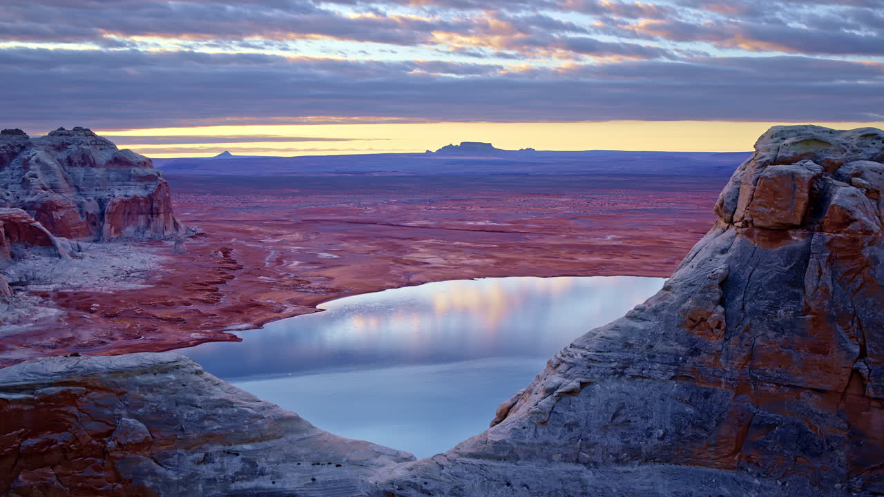 A drone sweeps over the arid beauty of Glen Canyon, capturing the interplay between rock and water.