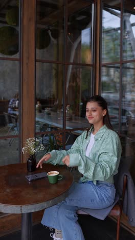 woman enjoying coffee at a cafe