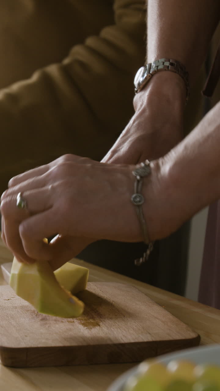 Cutting squash on wooden board