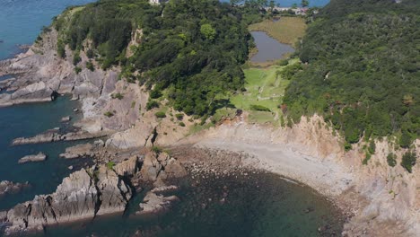 aerial tilt reveal of tomogashima, lighthouse and inland sea of japan