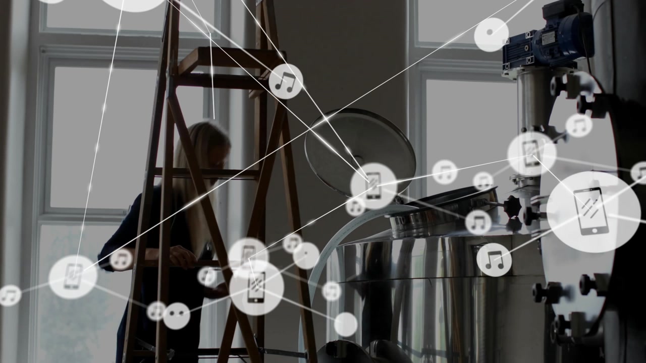 Engineer entering brewery, placing tablet and climbing ladder while connecting overlay around tank
