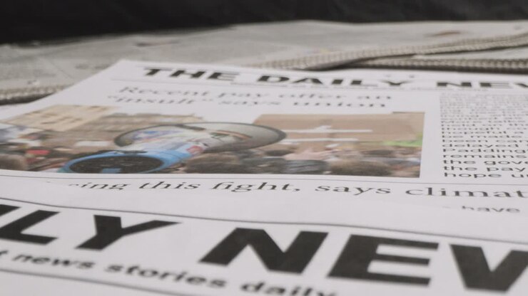 Newspaper Headline Discussing Extreme Weather Conditions And Industrial Strike Action