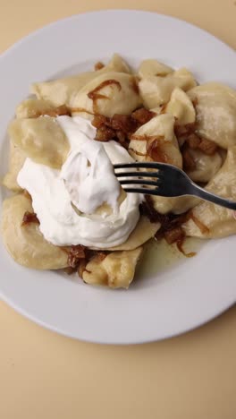 pierogi with sour cream and caramelized onions