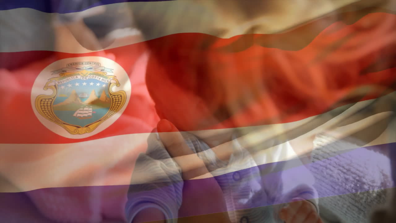 Cradling newborn baby over Costa Rica flag, symbolizing national pride and hope