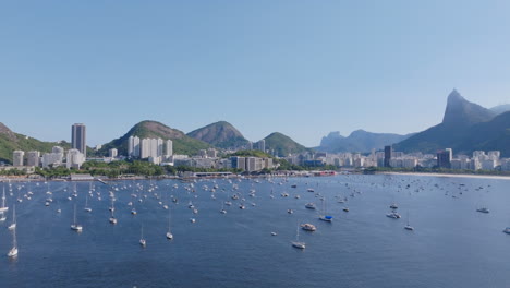 static aerial footage, hovering over the sailboats anchored in both of fogo bay and rio de janeiro brazil