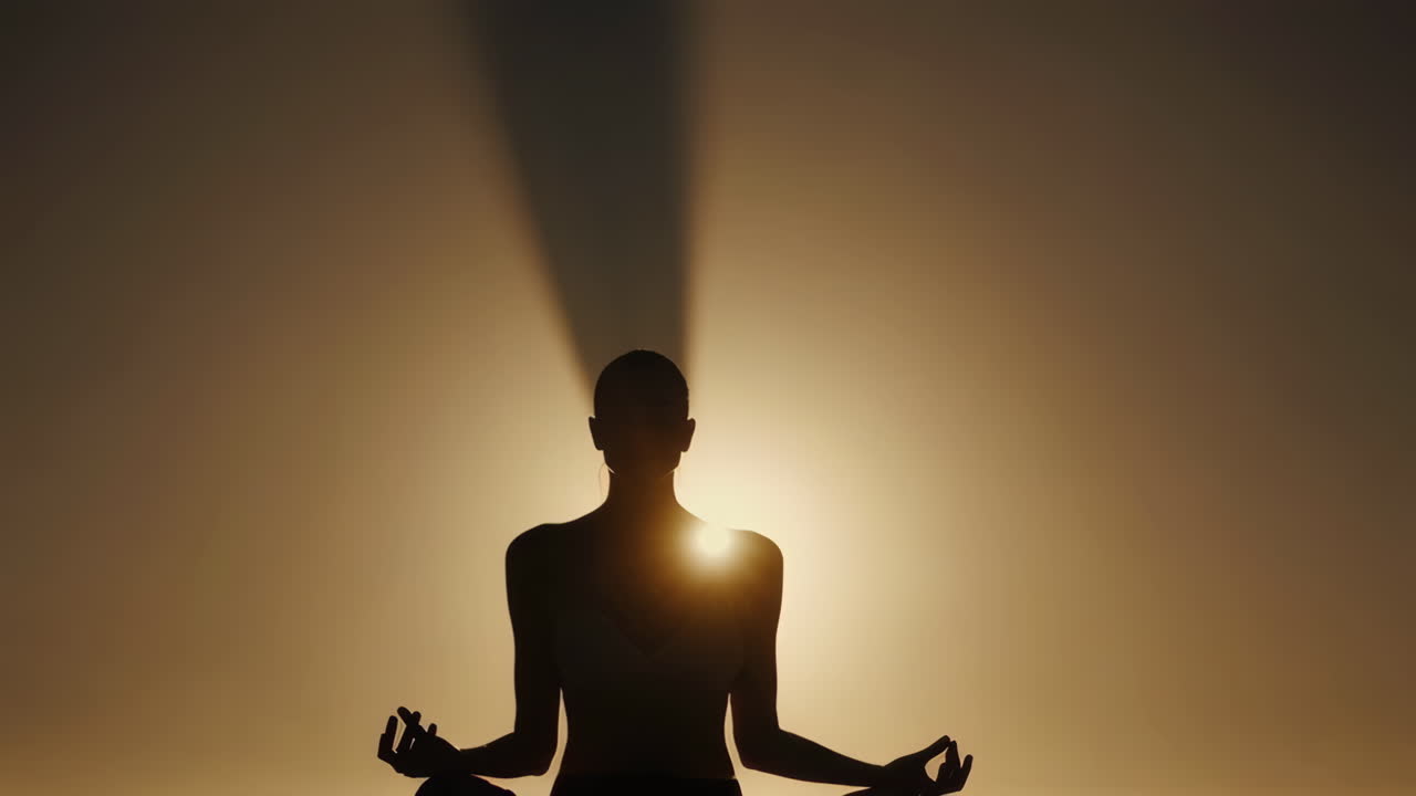 Silhouette of a Woman in Meditation