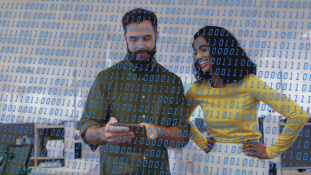 Vertical video: Tapping phone, man in olive shirt guiding woman in yellow at office, binary overlay